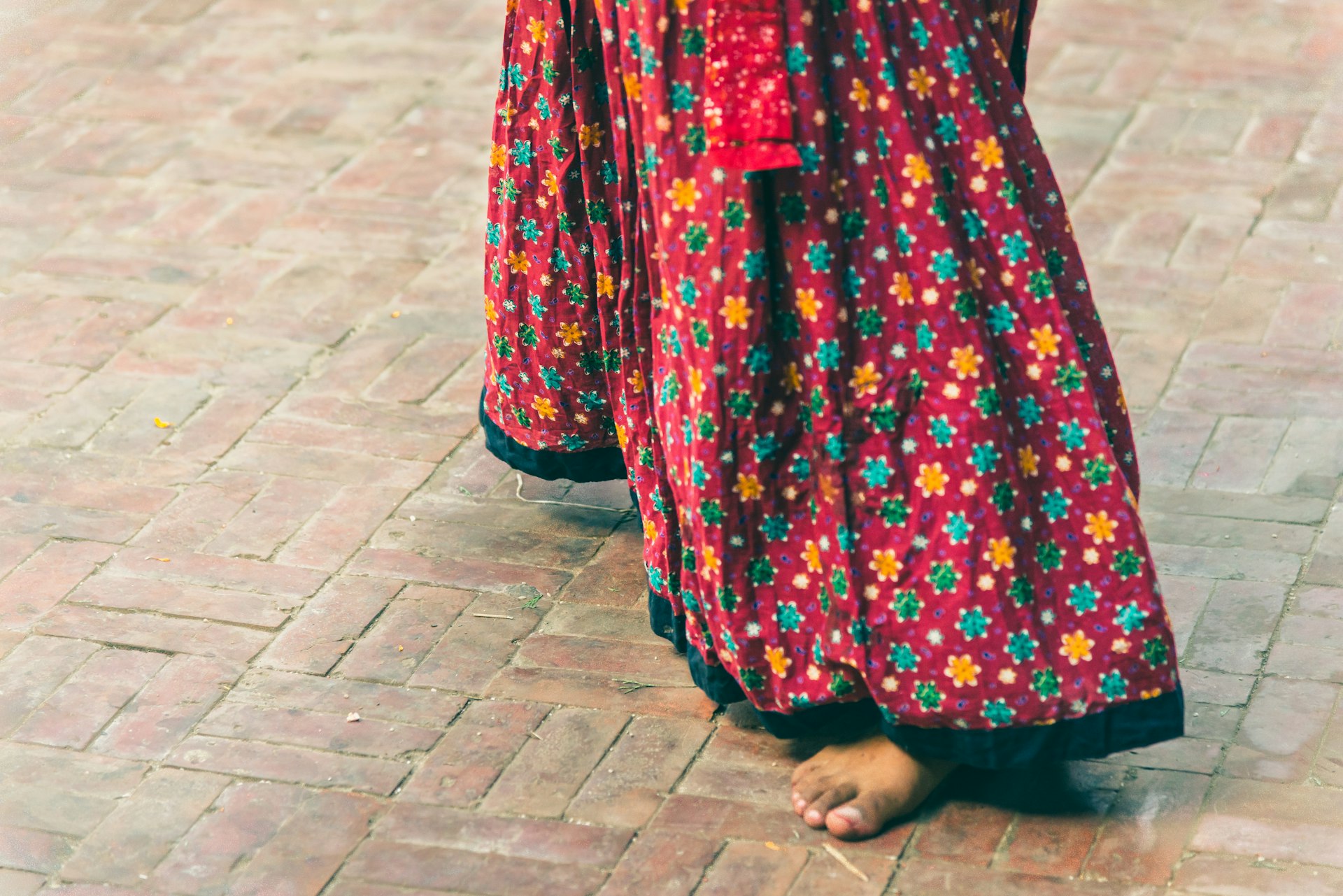 woman in red and white floral dress